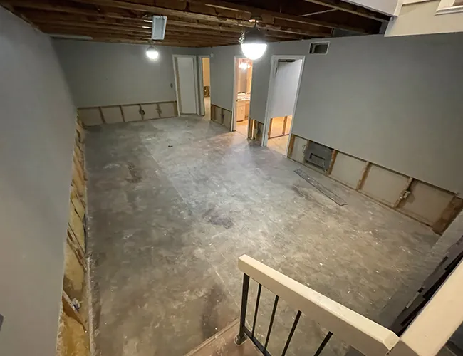 Professional water damage restoration and structural drying services for a residential basement in Boston.