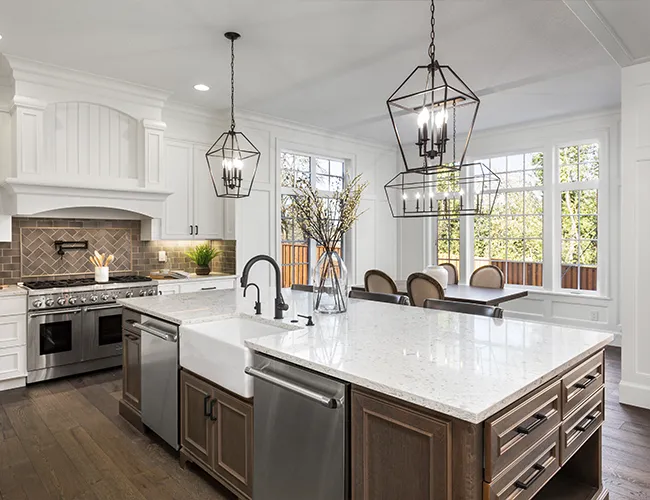 High-end kitchen remodel featuring a large marble island and custom cabinetry in Cambridge, MA.
